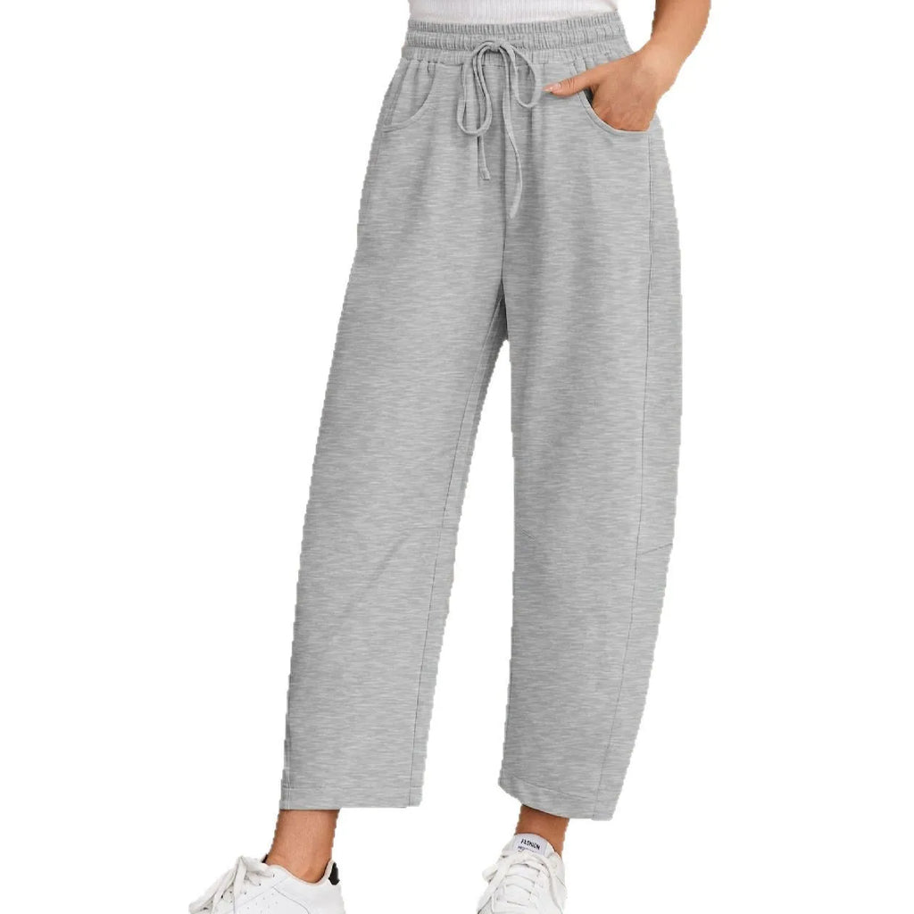 Women's loose cotton cropped sweatpants with drawstring waist and side pockets in multiple colours