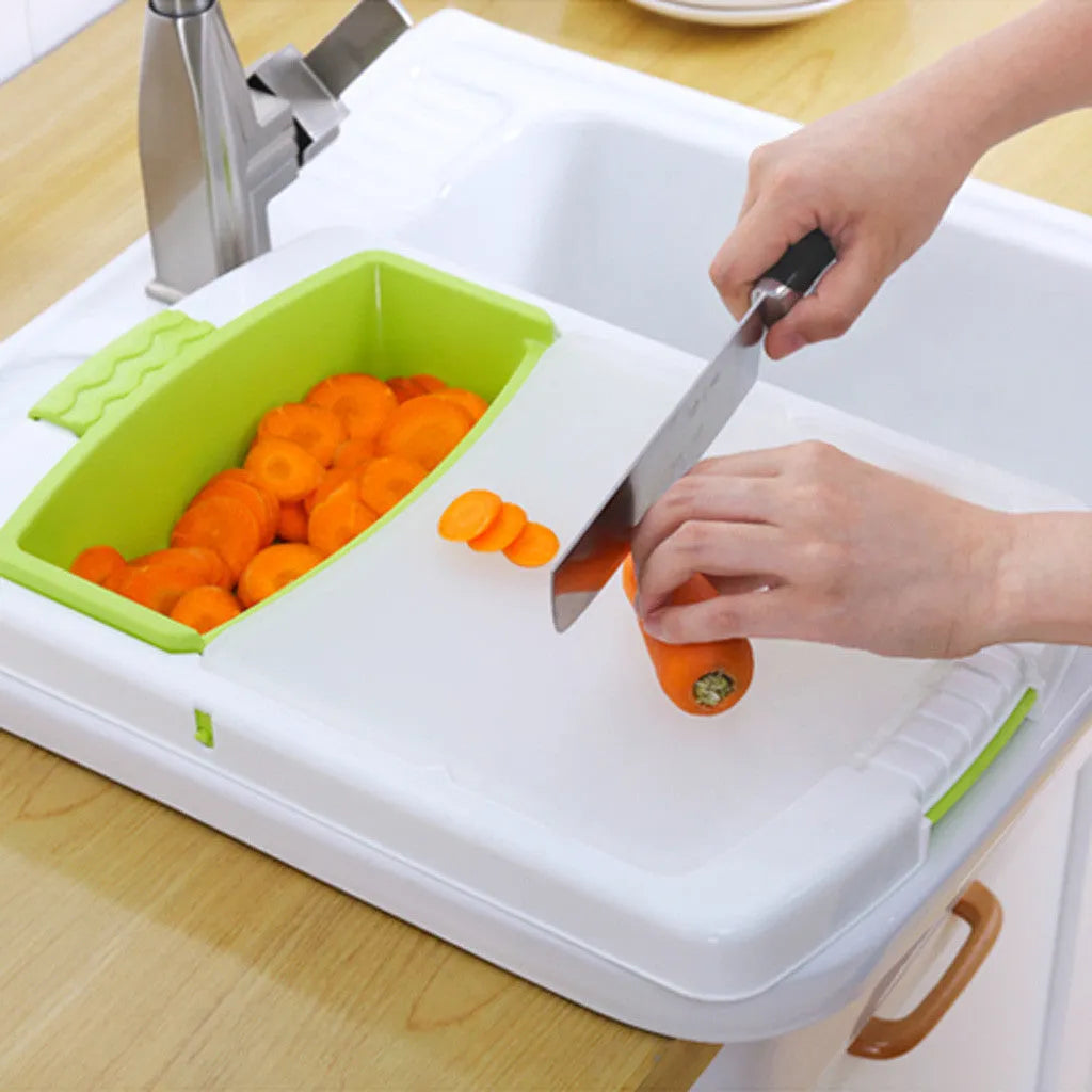 Green multi-function kitchen drain cutting board with storage trough and drainage holes on sink edge