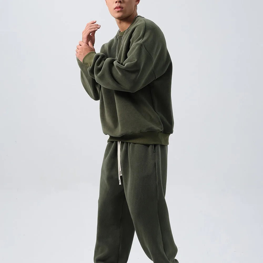 Men's loose fit polar fleece sports suit in winter colours, showing coat and trousers.