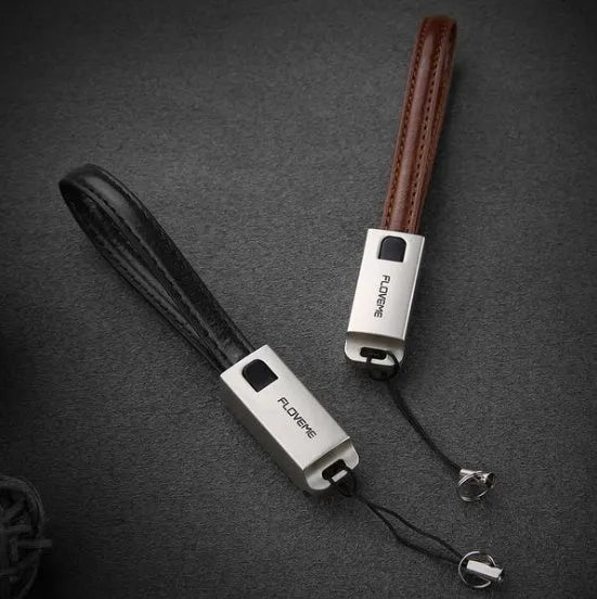 USB to Apple Lightning charging cable with leather braiding and zinc alloy connector in black, brown or red colours