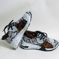 Women's suede casual sneakers with a wedge heel in leopard print colour.