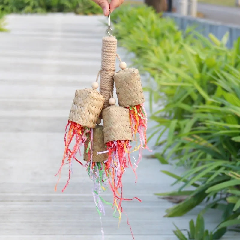 Colourful shredded paper and wood parrot hanging toy with sisal rope, 15 by 35 cm