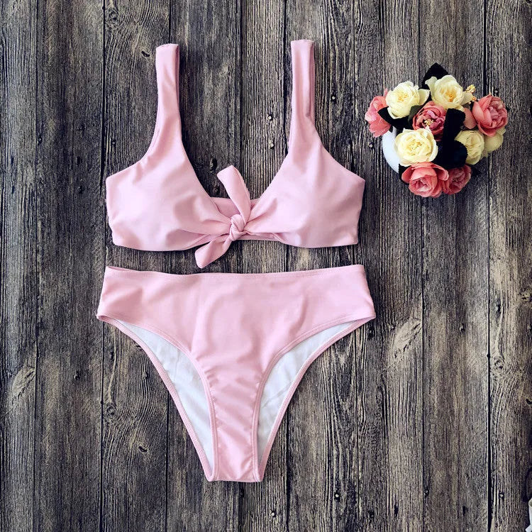 Solid colour bikini set on a hanger showing the bra and panties in a wine red shade.