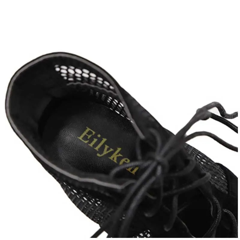 Black suede women's high heel shoes with lace-up ankle closure and an 11.5 cm heel.