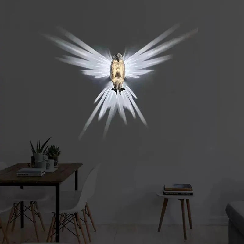 Eagle-shaped resin wall lamp with 3D print body projecting light and shadow on a wall