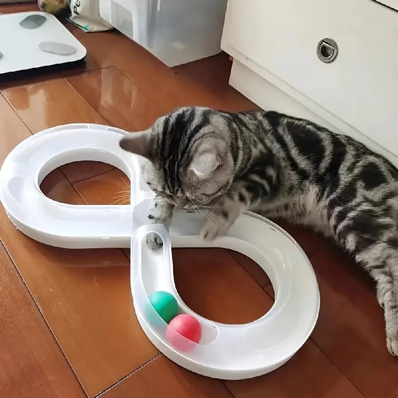 Blue and white cat turntable track ball toy with teasing stick on a flat surface.