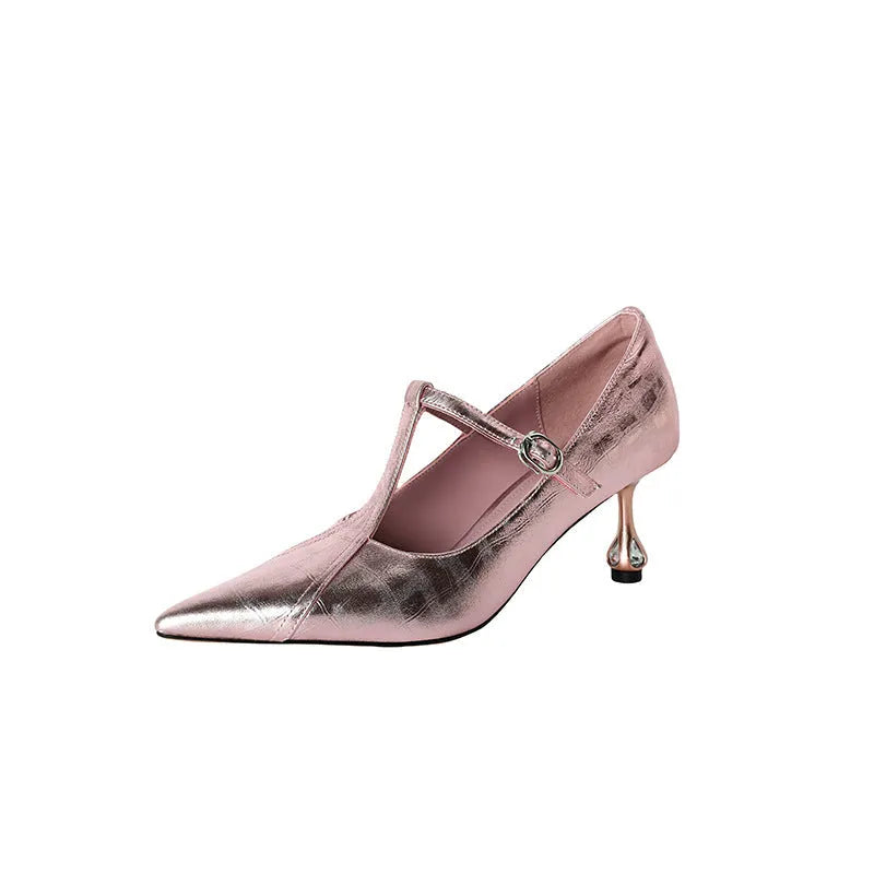 Women's gun metal grey pointed-toe pumps with a chunky mid heel on a rubber sole.
