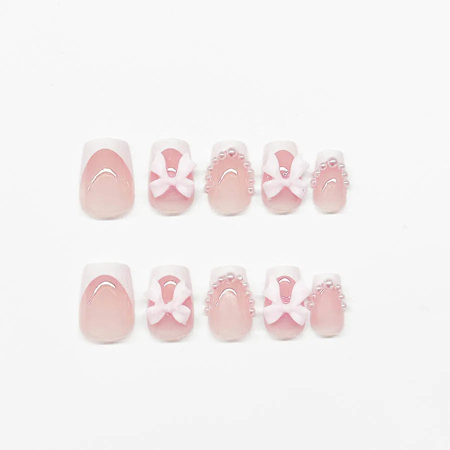 French manicure false nails with white bow design on short square nails with S274 adhesive glue