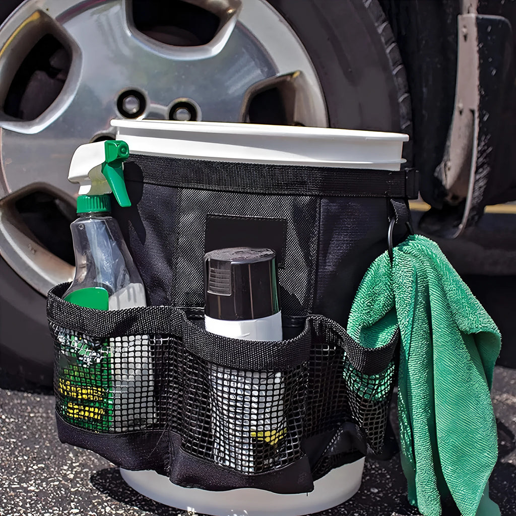 Black cylindrical polyester hanging storage bag with straps, designed to fit a 5 gallon barrel.
