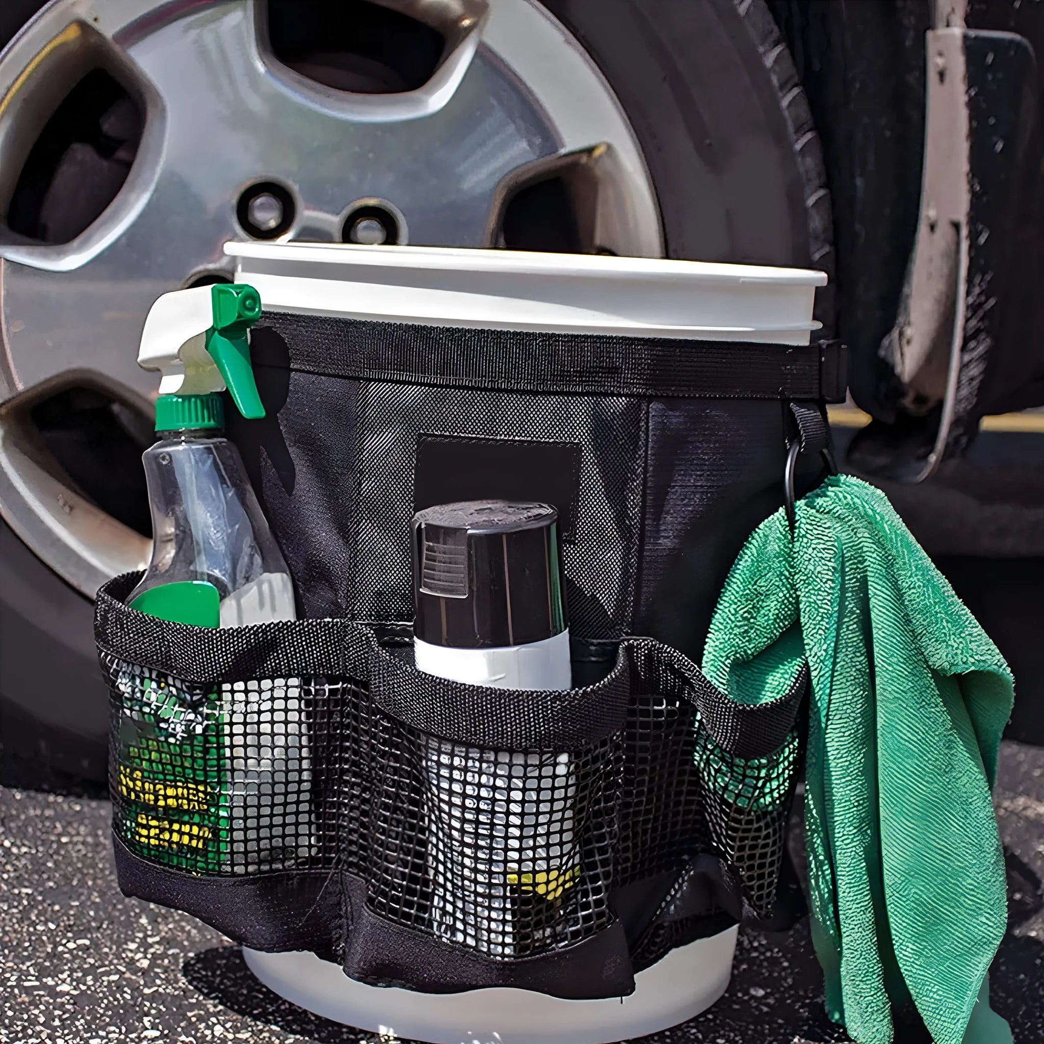 Black cylindrical polyester hanging storage bag with straps, designed to fit a 5 gallon barrel.