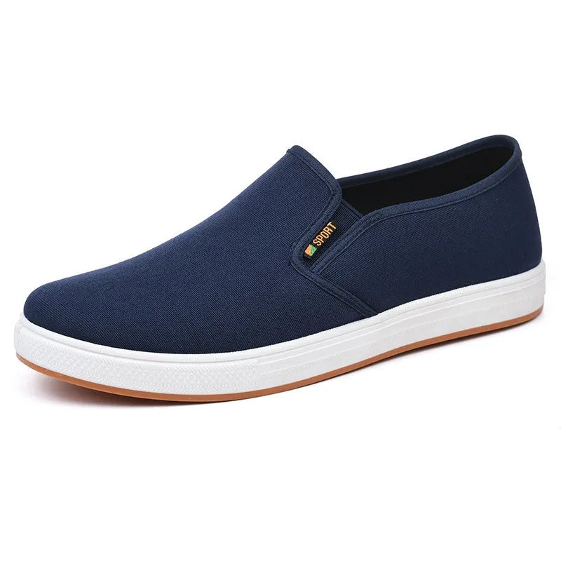 Men's black canvas slip-on shoes with round toe and injection-moulded sole