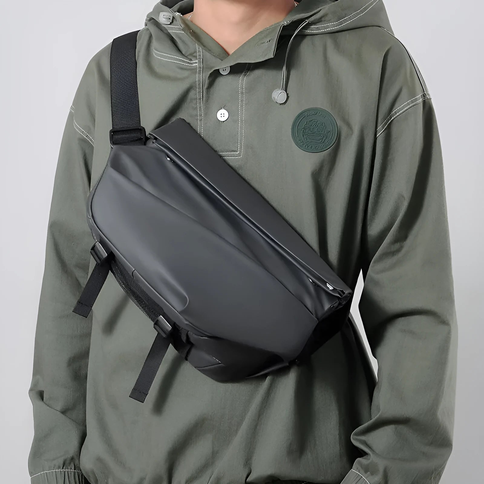 Grey PU leather crossbody bag showing internal phone and document compartments with zip opening