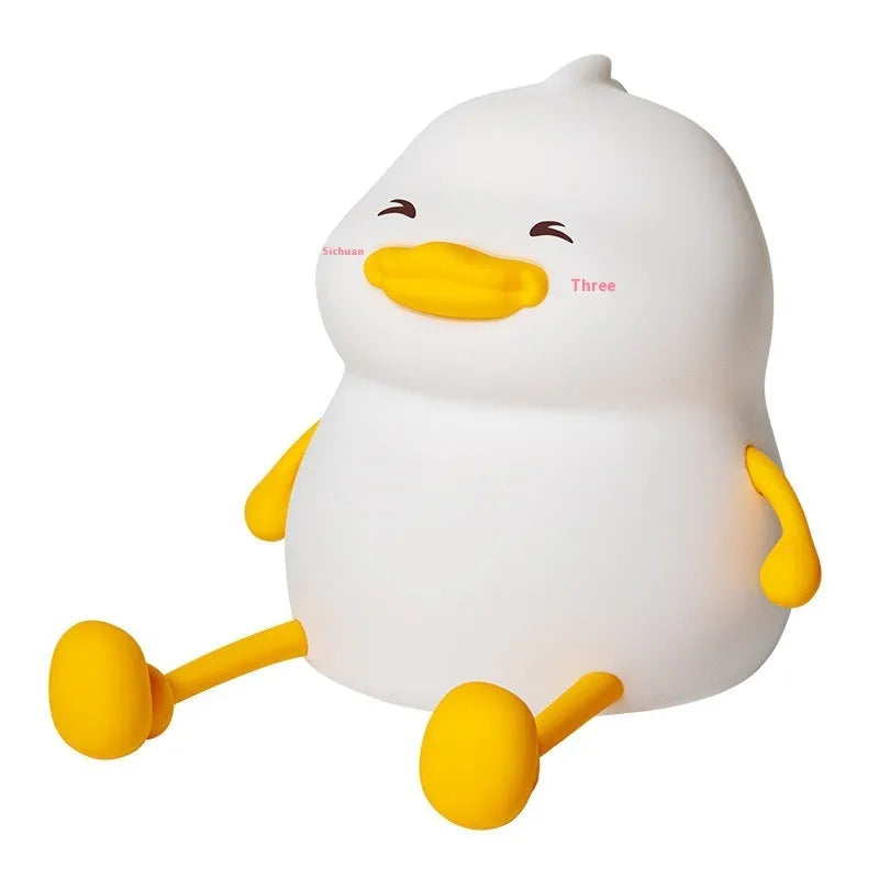 Chubby night light desk lamp with silicone phone holder surface showing three brightness settings