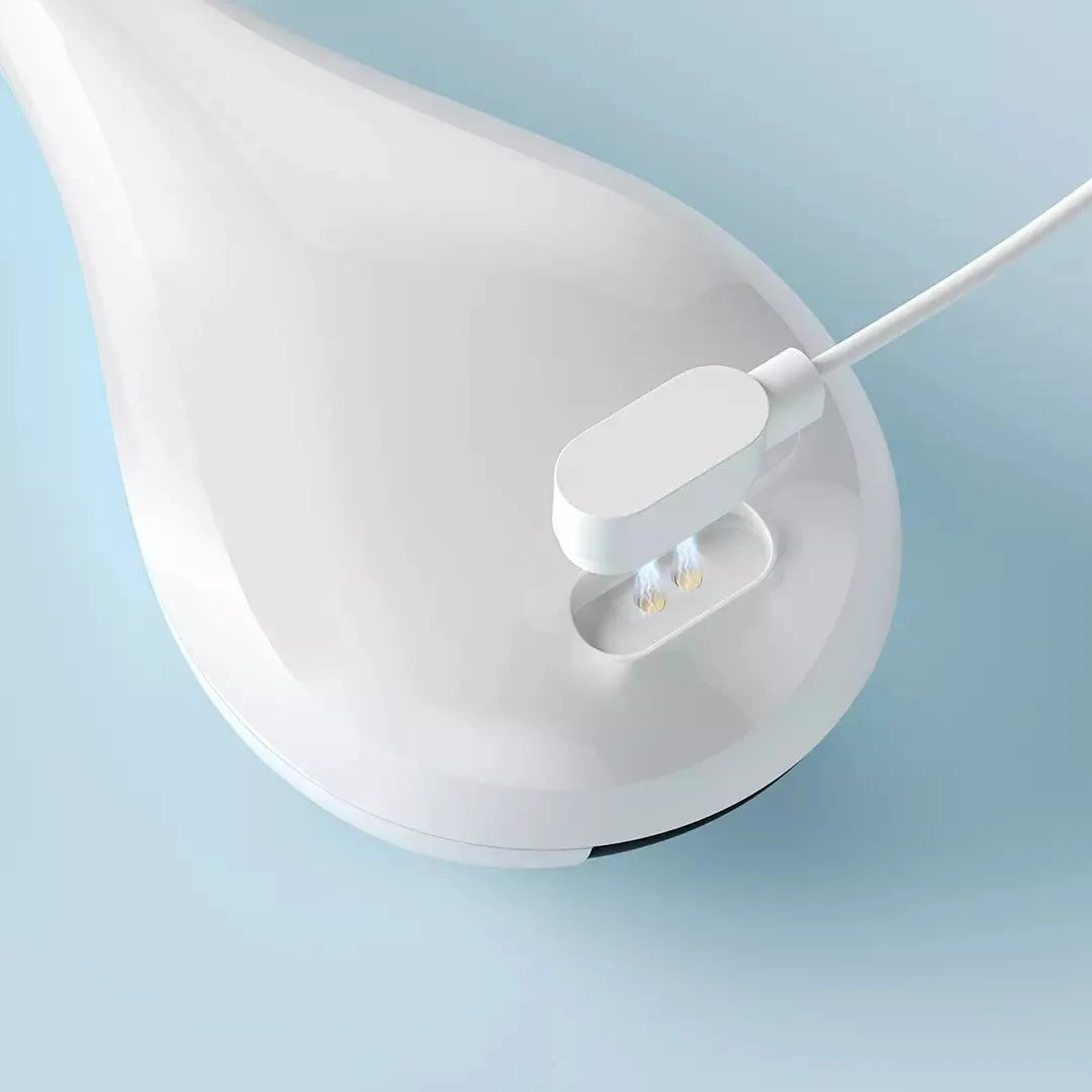 White visual dental mirror endoscope with 1080P HD camera and Bluetooth connectivity on a magnetic charging base