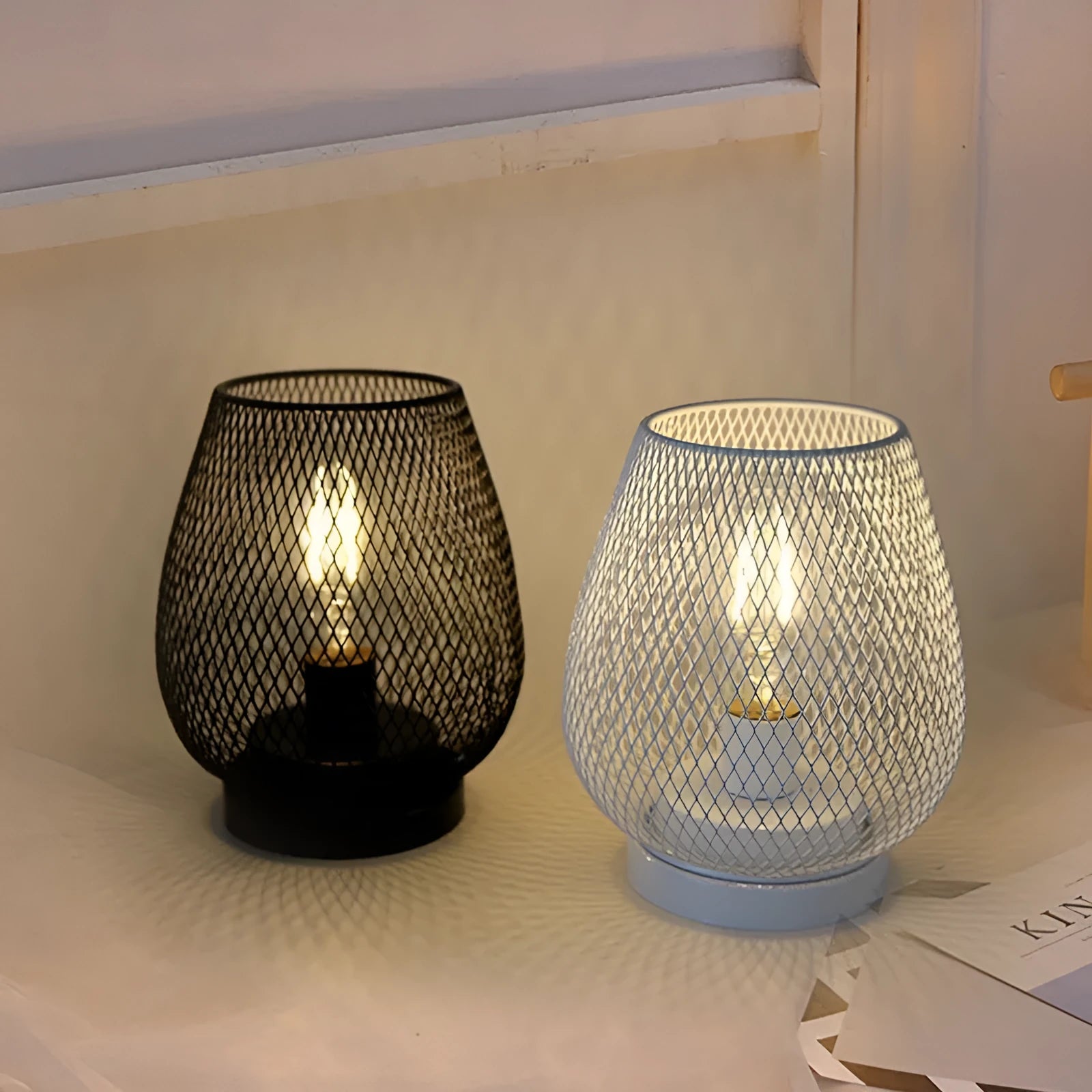 Retro iron art battery-powered table lamp with hollowed-out birdcage design in white finish