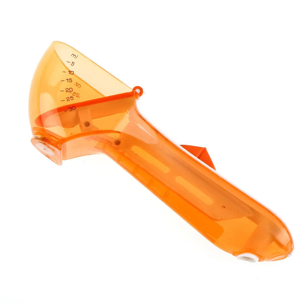 Orange and blue digital measuring spoons with magnetic snap showing nested storage on a fridge surface