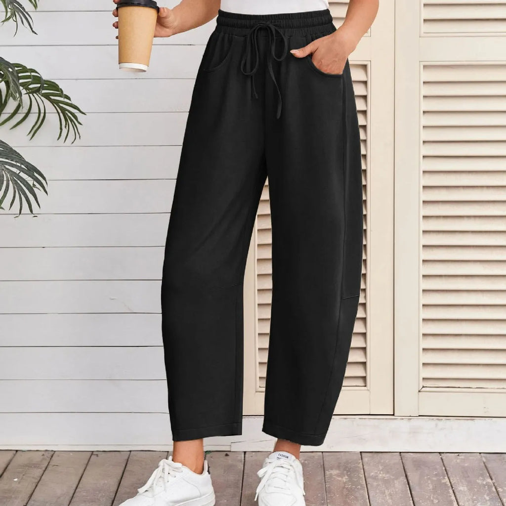 Women's loose cotton cropped sweatpants with drawstring waist and side pockets in multiple colours