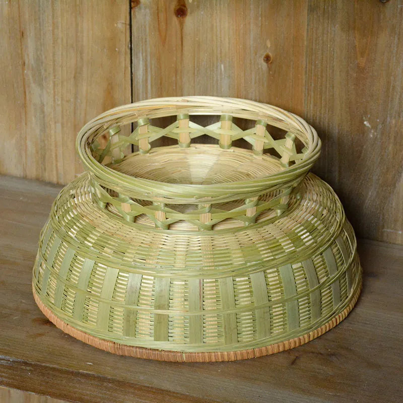 Handmade natural bamboo storage basket shown in one of three available sizes.