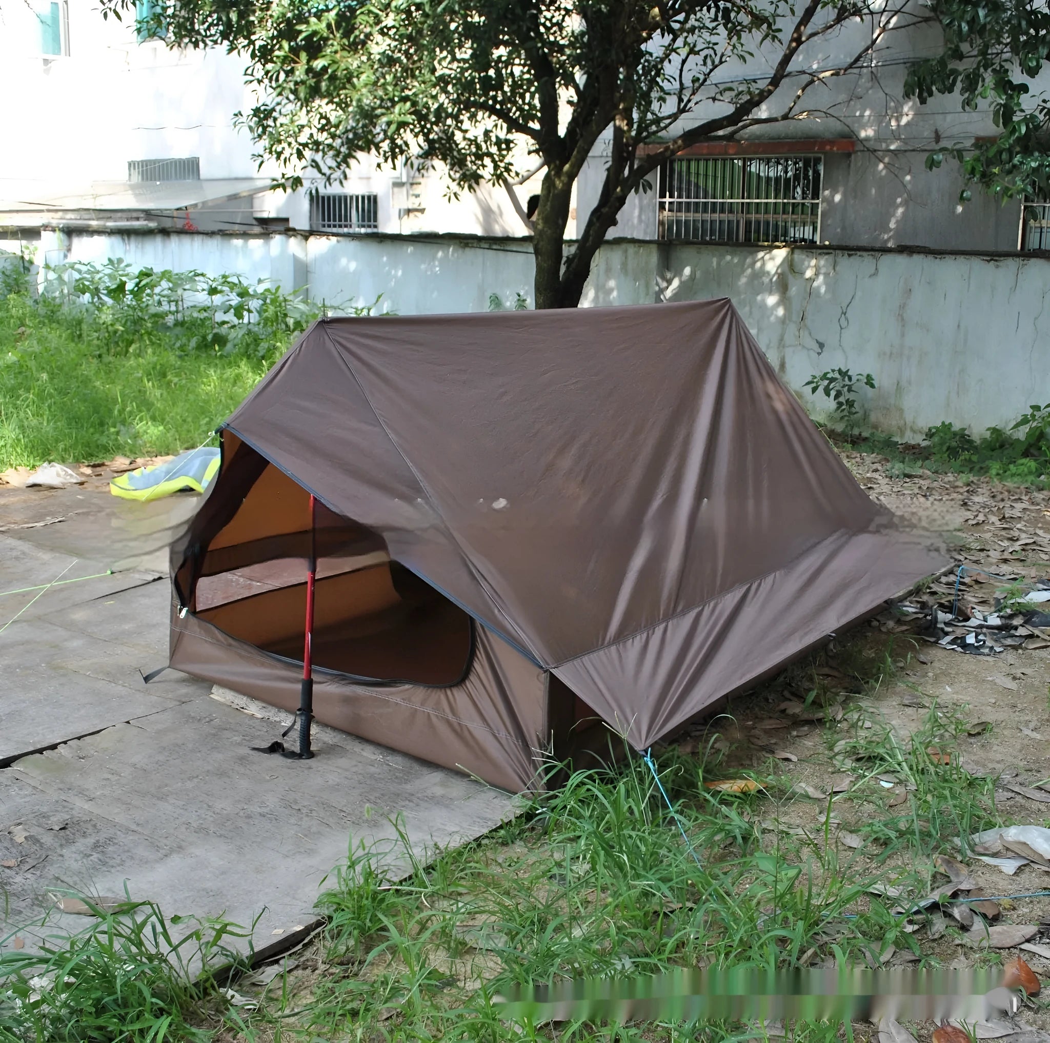 Brown or white A-line pole-free tent pitched with hiking canes showing 210x150x110cm dimensions