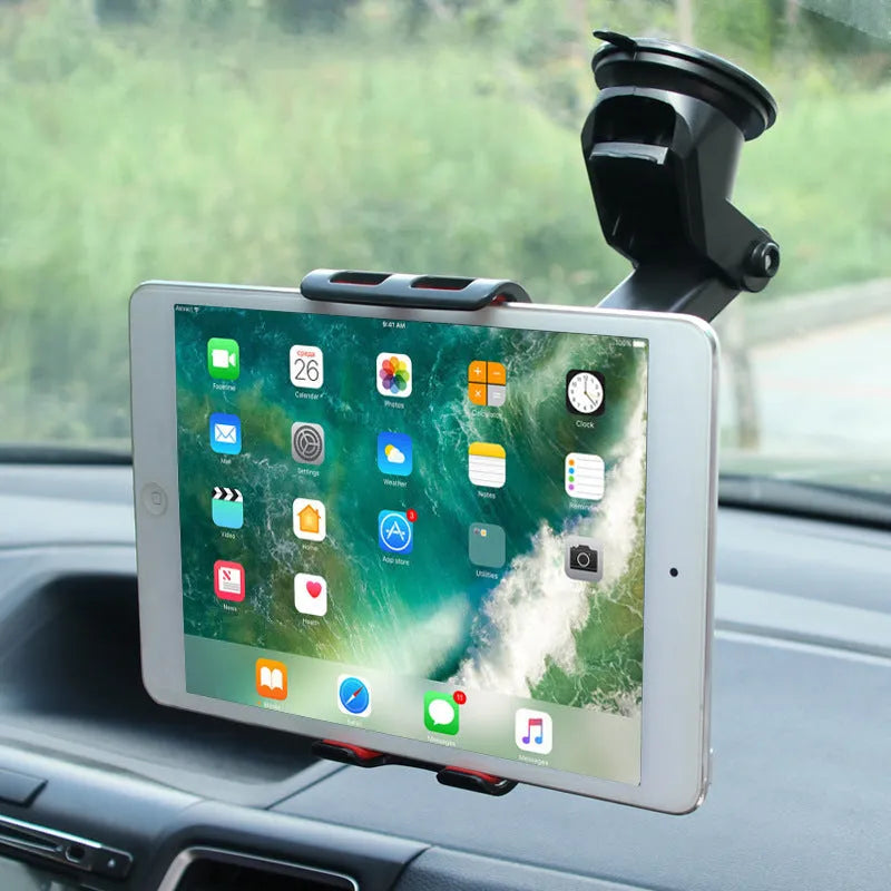 Black tablet PC universal stand car bracket mounted on dashboard centre console holding a tablet