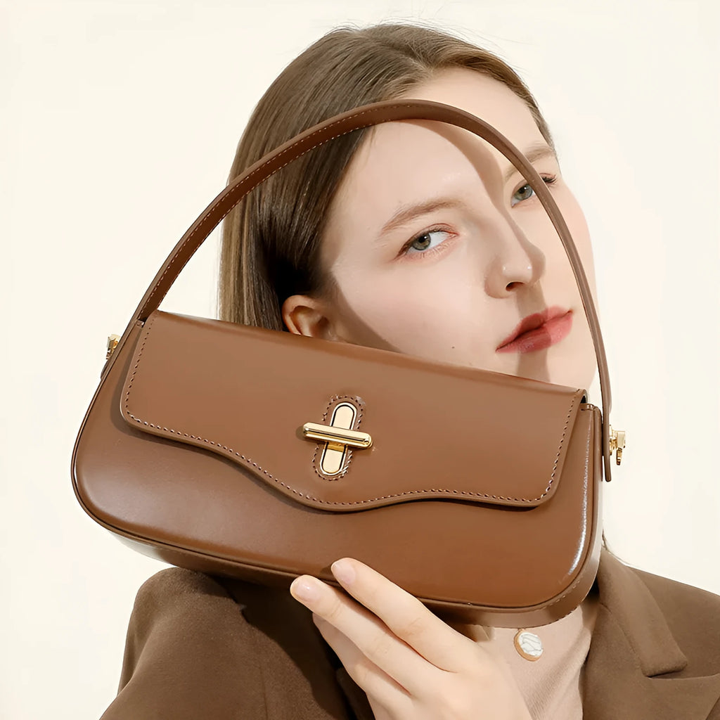 Genuine leather horizontal square baguette bag in black with lock detail