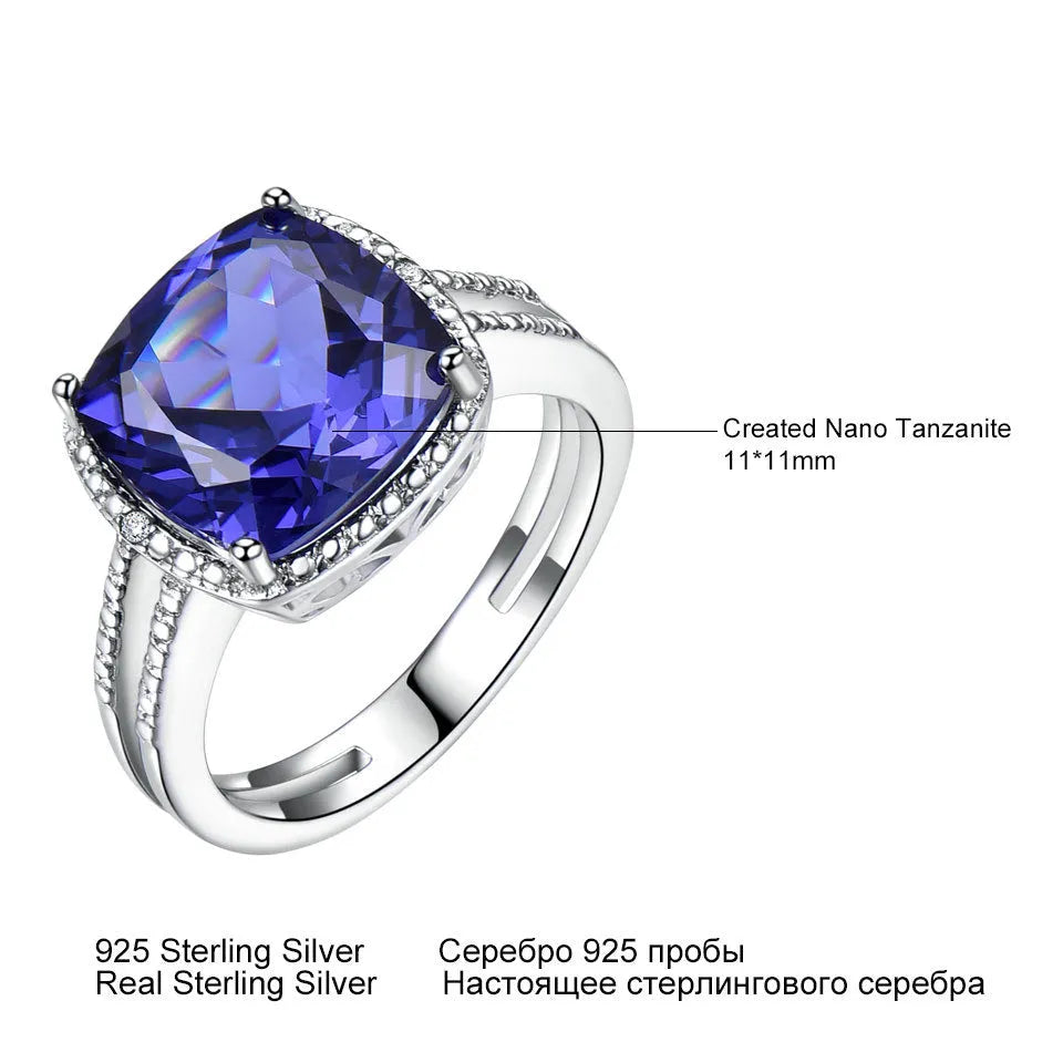 Blue Tanzanite gemstone set in a sterling silver women's ring on a white background.