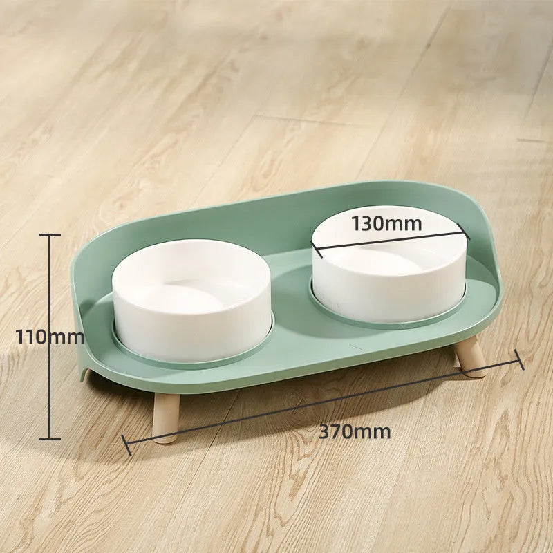 Green tilted double pet bowl set with adjustable angle for cats and small dogs