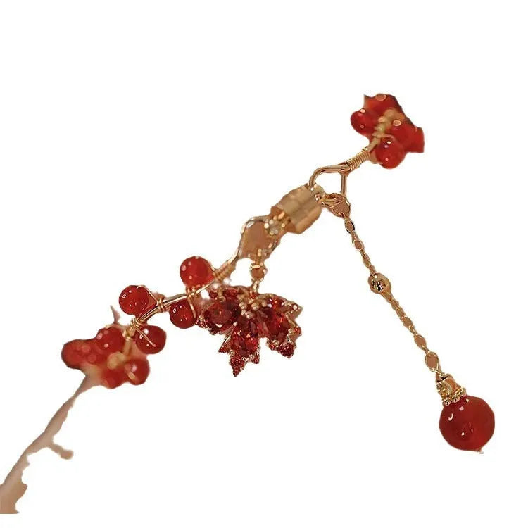 Maple Leaf Girl red ginkgo leaf magnetic bracelet on wrist, electroplated alloy finish