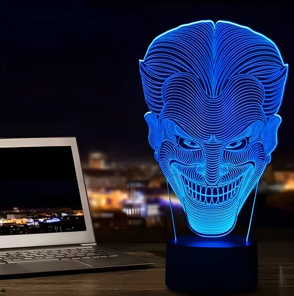 USB-powered 3D acrylic LED lamp showing colour gradient effect, with remote control and base on a desk.