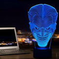 USB-powered 3D acrylic LED lamp showing colour gradient effect, with remote control and base on a desk.