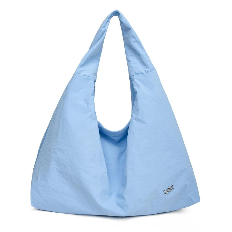 Soft nylon heart-shaped underarm bag for women in black, blue, khaki, or yellow.