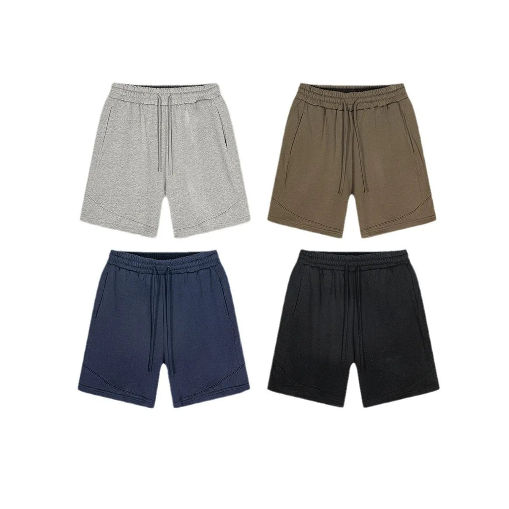 Solid colour loose cotton children's sports shorts in black, navy blue, mixed grey, and brown