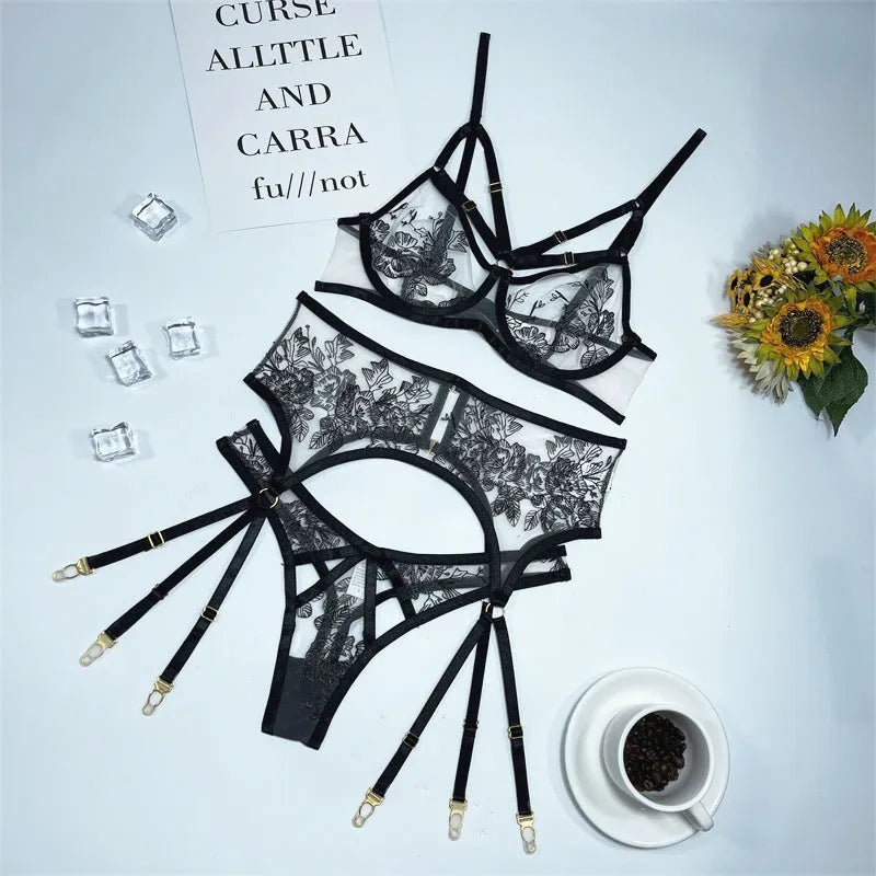 Black women's lace mesh floral print three-piece set with top, trousers, and waist ring on a hanger.