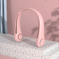 Pink portable bladeless neck fan being worn, showing USB charging port and control button.
