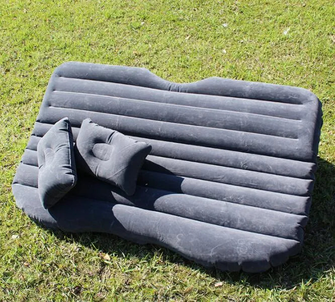 Car inflatable bed with 0.5mm flocking cloth in black wave, including pillows and pump, set up in a car rear seat
