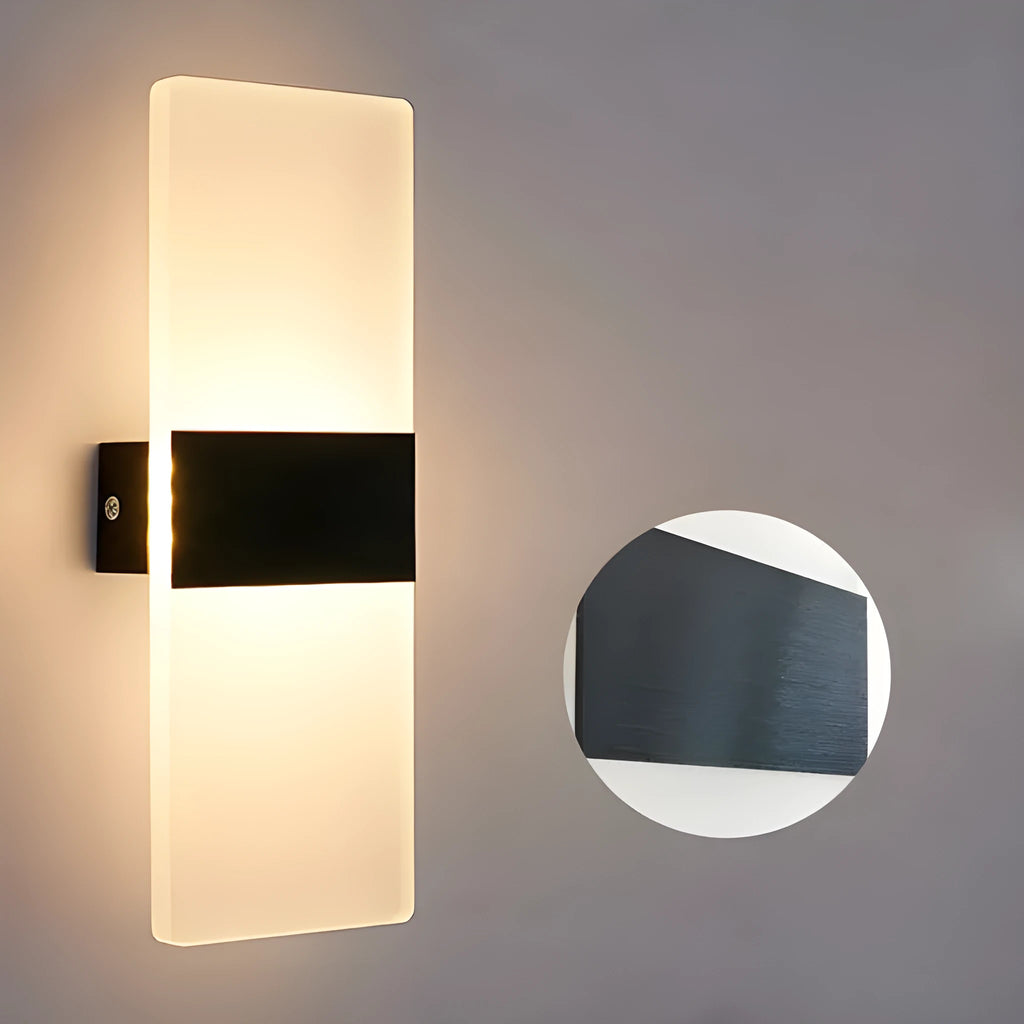 Modern LED bedside wall lamp with acrylic shade, 27x10cm, in black finish, mounted on a wall