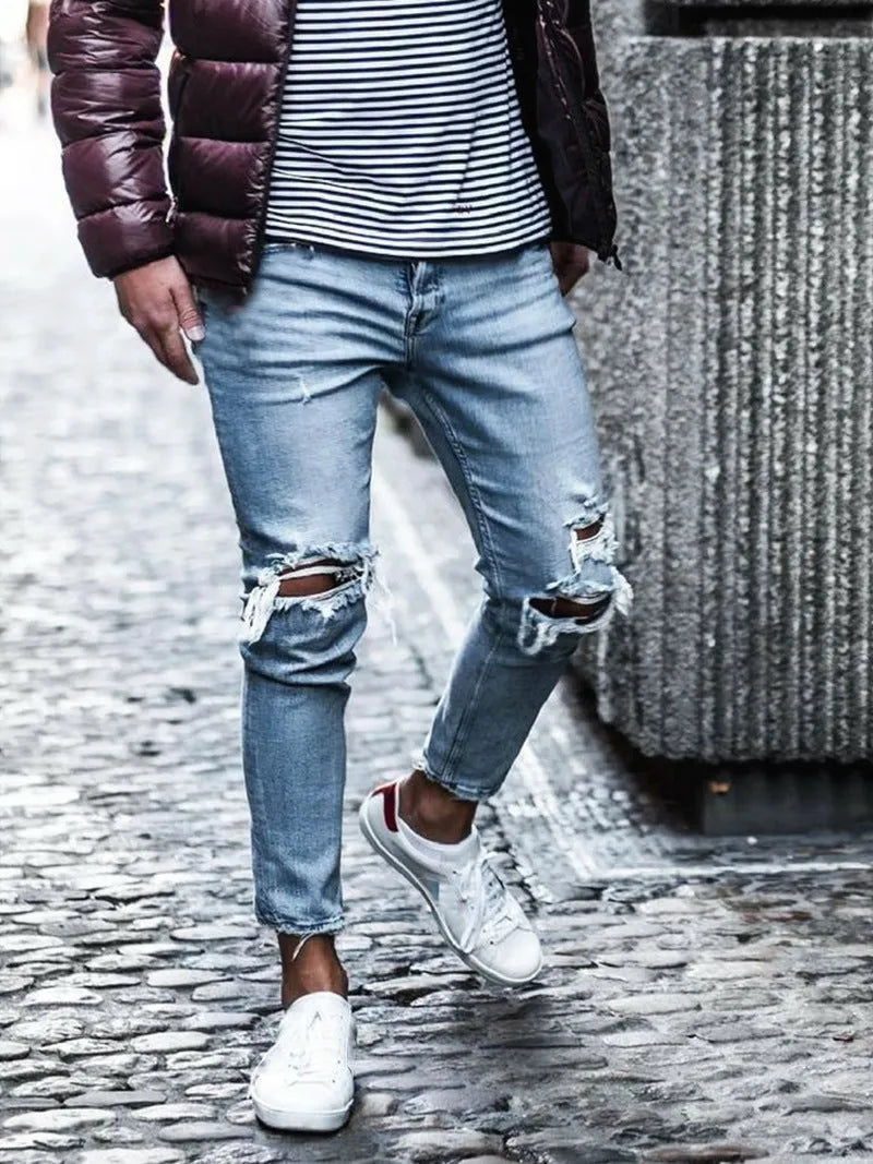 Men's light blue straight fit jeans with worn and embroidered detailing, five-point length, mid-rise waist