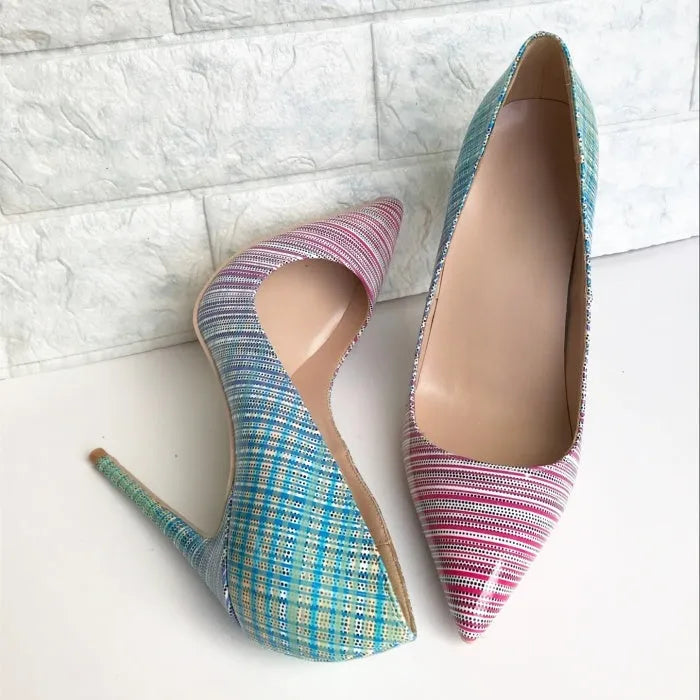 Ladies pink and blue gradient patent leather pointed toe high heels on a white background