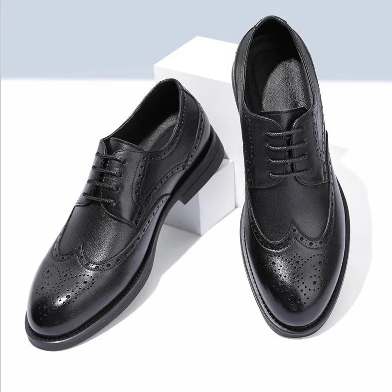 Men's black brogue leather shoes with traditional perforated toe design on business styling
