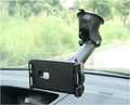 Black tablet PC universal stand car bracket mounted on dashboard centre console holding a tablet
