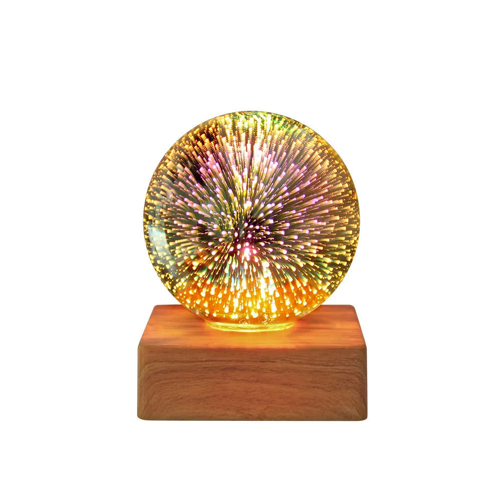 USB 3D firework crystal ball night light with warm LED, touch control, and starry sky effect on a wooden desk