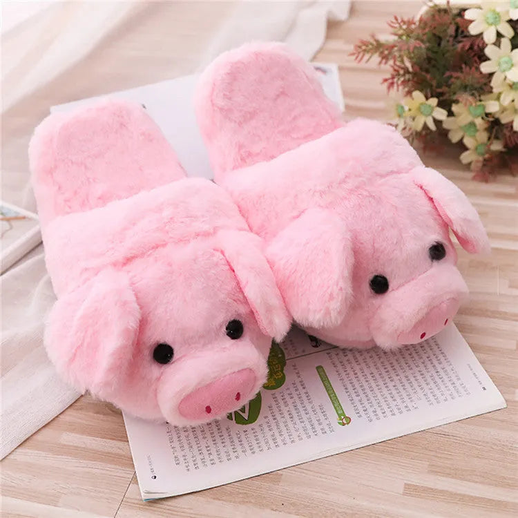 Pink pig floor slippers with soft plush exterior and cushioned interior for indoor wear