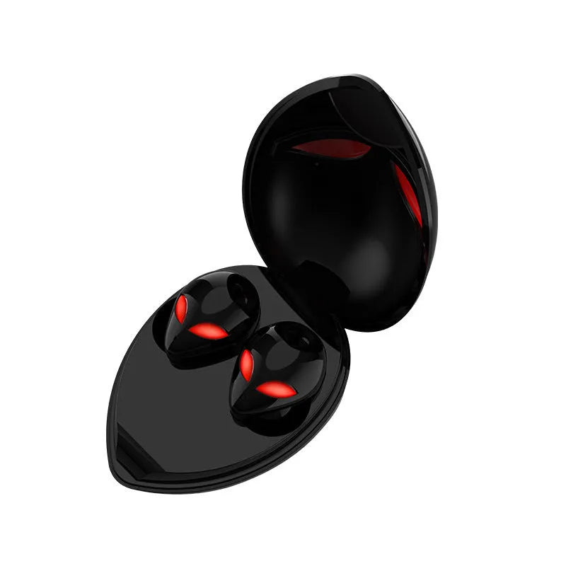 Creative Outer T8 Starman black and white alien design wireless earbuds with LED lights next to charging case.