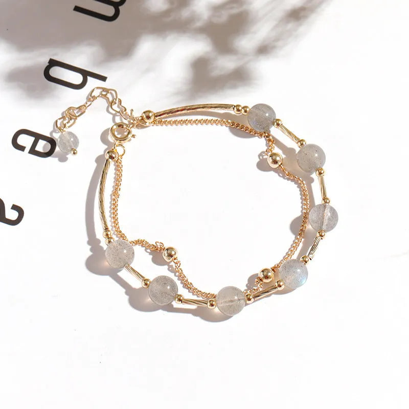 Crystal bracelet with double-layer copper tube and moonstone finish on white background