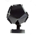 LED star projector showing constellation patterns on bedroom ceiling with remote control