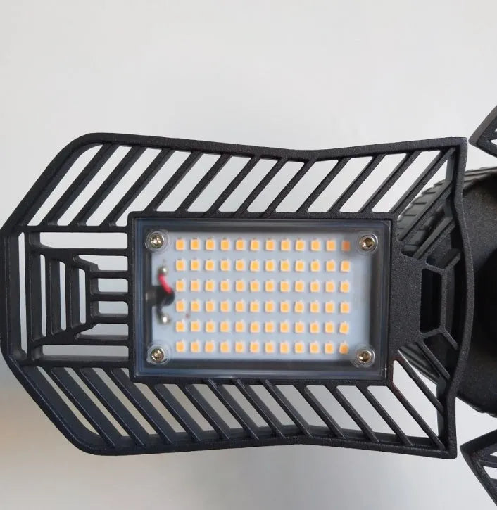 A silver die-cast aluminium foldable industrial LED lamp for garage or workshop use.
