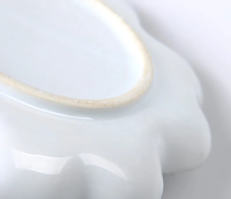 White ceramic plum blossom shaped painting palette for watercolour, acrylic and oil paints