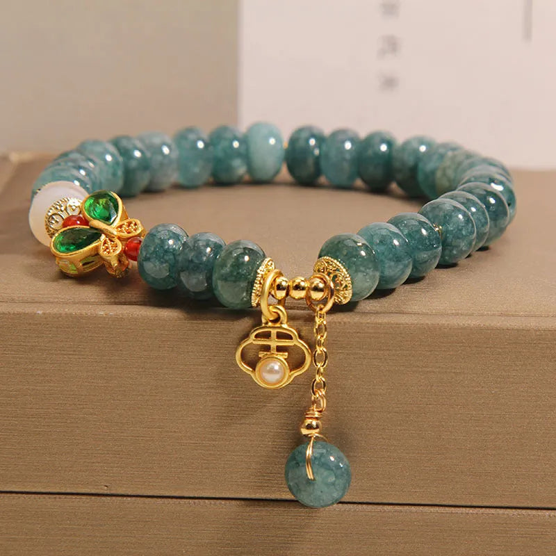 Blue water jade abacus beads crystal bracelet with white agate and butterfly motif on alloy base