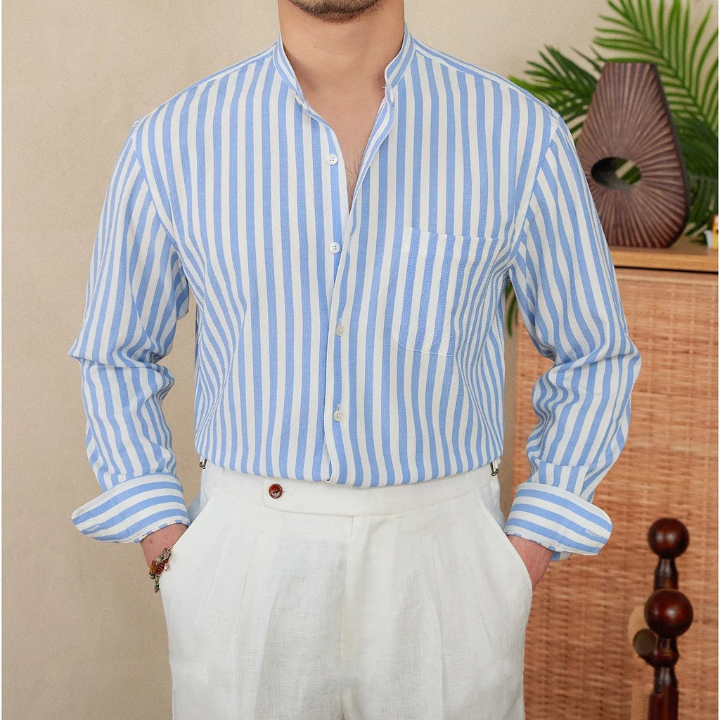 Loose fit seersucker striped long sleeve shirt with baseball collar in blue colour, front view on white background