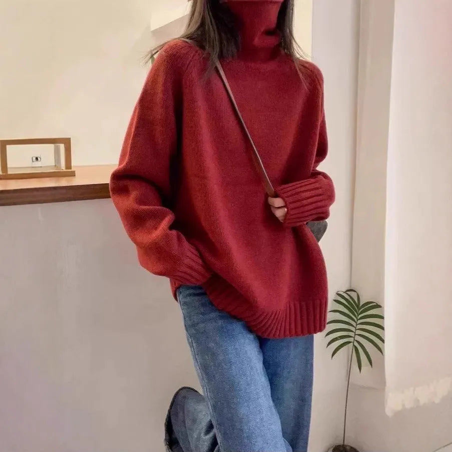 Women's thick loose turtleneck sweater with curling collar and 3D pattern in camel colour.